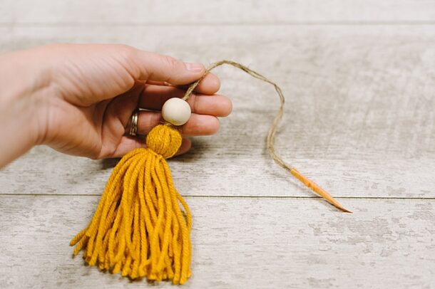 How To Make A Yarn Tassel And Wooden Bead Ornament 