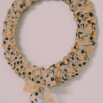 How to Make a Burlap Halloween Wreath using two colors of polka dot burlap ribbon in orange and black from the Dollar Tree.