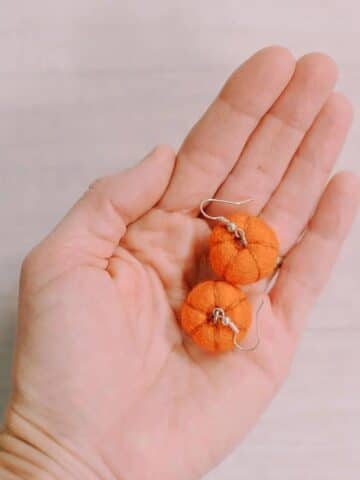 Fall earrings made with felt ball pumpkins.